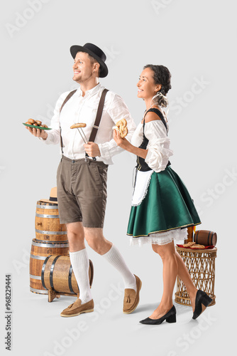 Happy mature waiters in tra...