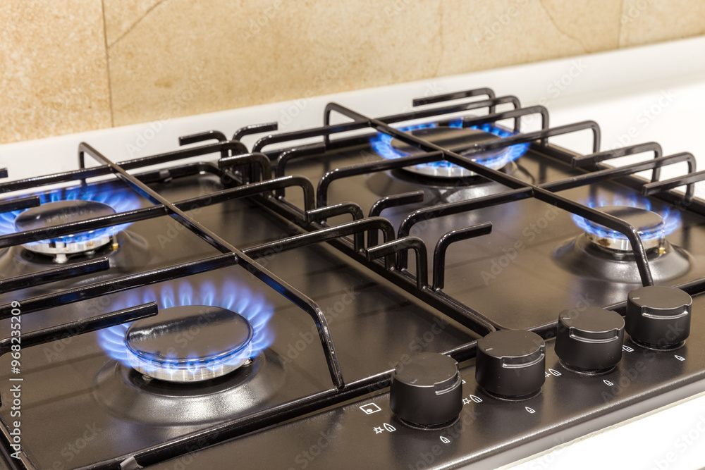 Gas burner on black modern kitchen stove Gas burner on black modern kitchen stove