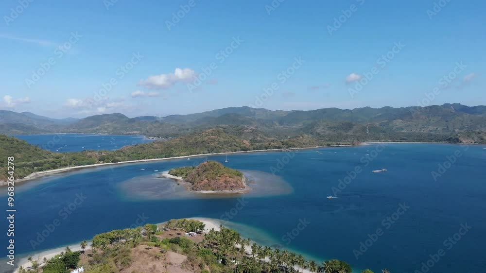 View from Island Gili Asahan to Gili Goleng, Lombok, Indonesia, Southeast Asia.
Aerial view from Island Gili Asahan to Gili Goleng and the east coast of Lombok, Indonesia. View from Island Gili Asahan to Gili Goleng, Lombok, Indonesia, Southeast Asia.
Aerial view from Island Gili Asahan to Gili Goleng and the east coast of Lombok, Indonesia.