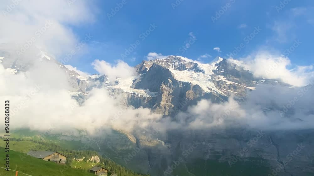 Eiger towering above the clouds. Eiger towering above the clouds.
