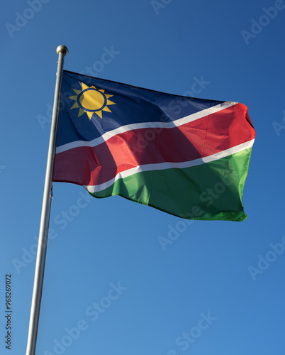 Namibia national flag swinging under the blue sky photo