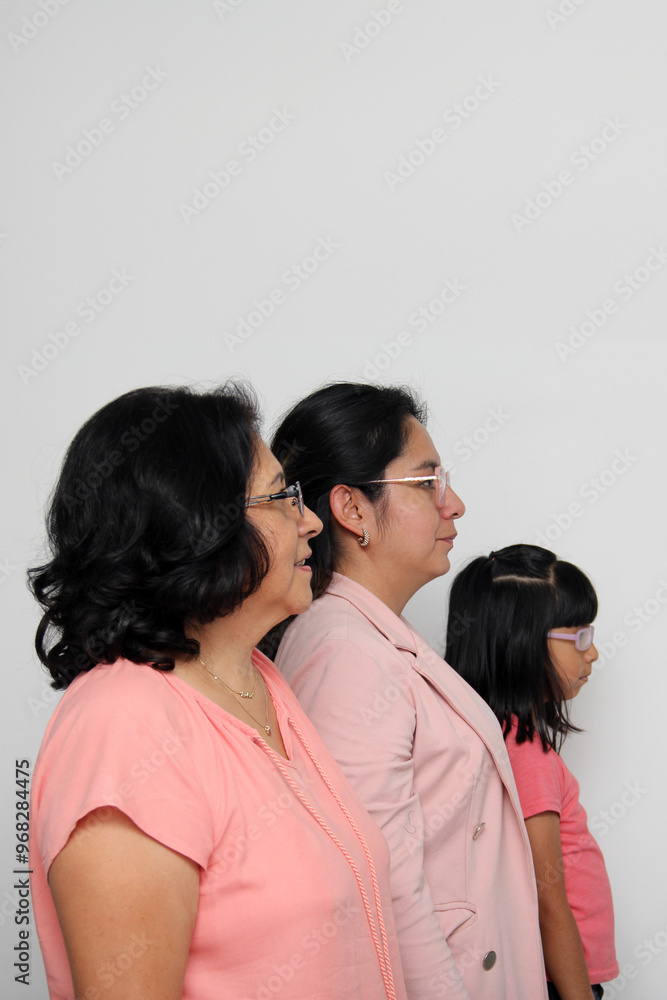 Family of grandmother, mother and daughter see with surprise and enthusiasm promotions and discounts that they are excited to buy Family of grandmother, mother and daughter see with surprise and enthusiasm promotions and discounts that they are excited to buy