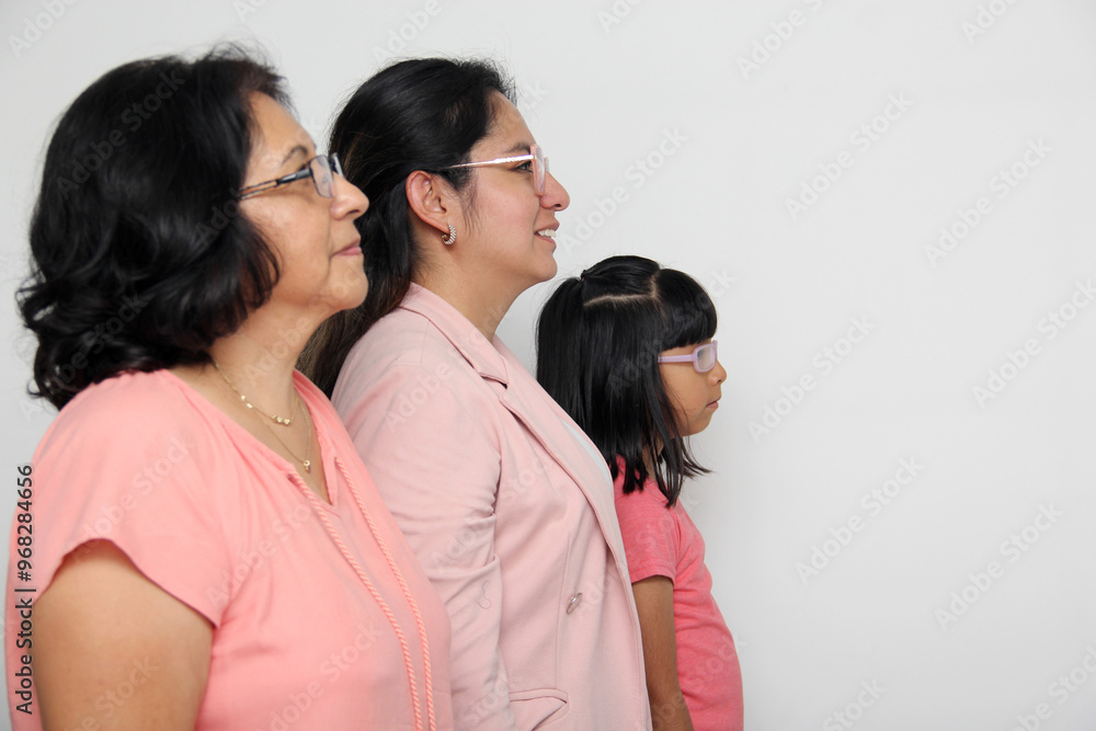 Family of grandmother, mother and daughter see with surprise and enthusiasm promotions and discounts that they are excited to buy Family of grandmother, mother and daughter see with surprise and enthusiasm promotions and discounts that they are excited to buy