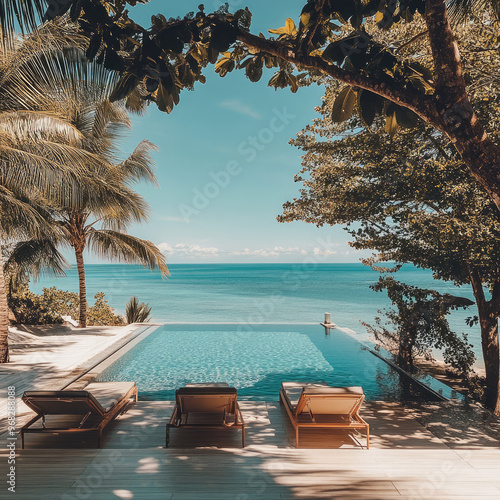 Fototapeta Naklejka Na Ścianę i Meble -  the landscape design of the pool  by the beach hotel looking into the endless pool and far ocean view 