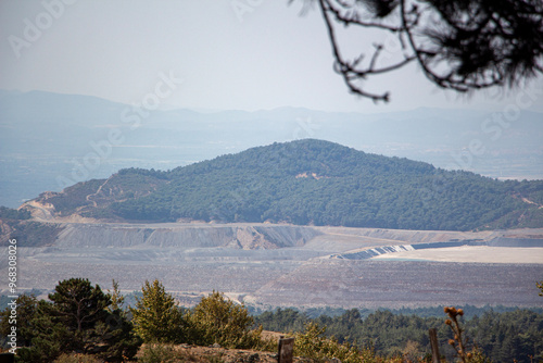 Landscape of an open pit mine with lots of sand and rocks. Landscape view of an open pit mine for the extraction of iron ore