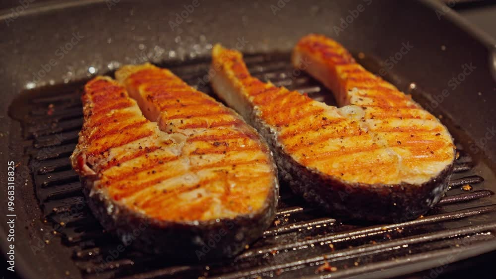 Two steaks sizzling on grill pan Two steaks sizzling on grill pan