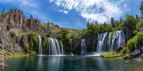 Waterfalls flowing over moss covered rocks in the wilderness