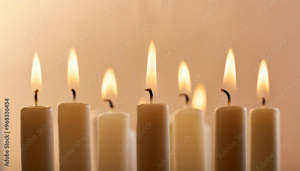 Flame of many candles burning on the background blue color Flame of many candles burning on the background blue color