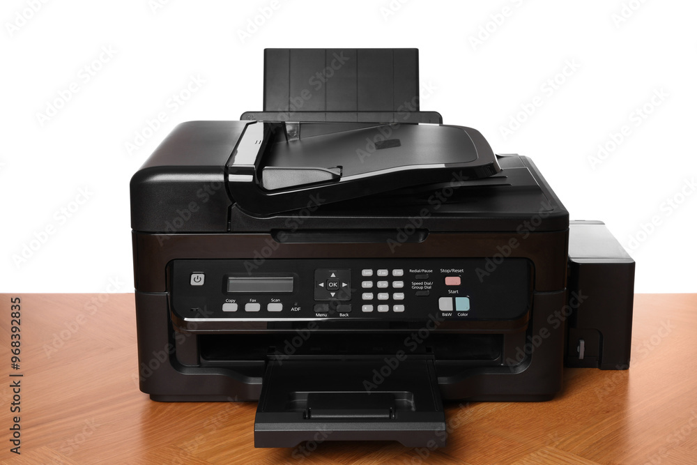 One modern printer on wooden table against white background One modern printer on wooden table against white background