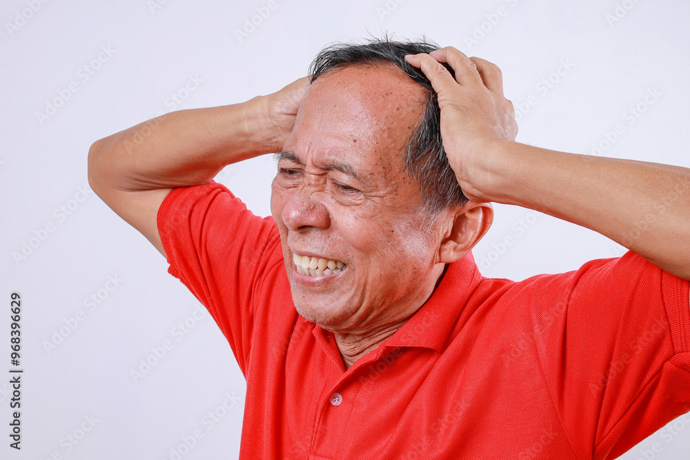 Asian senior man put hands on head suffering from headache and stressed because pain and migraine Asian senior man put hands on head suffering from headache and stressed because pain and migraine