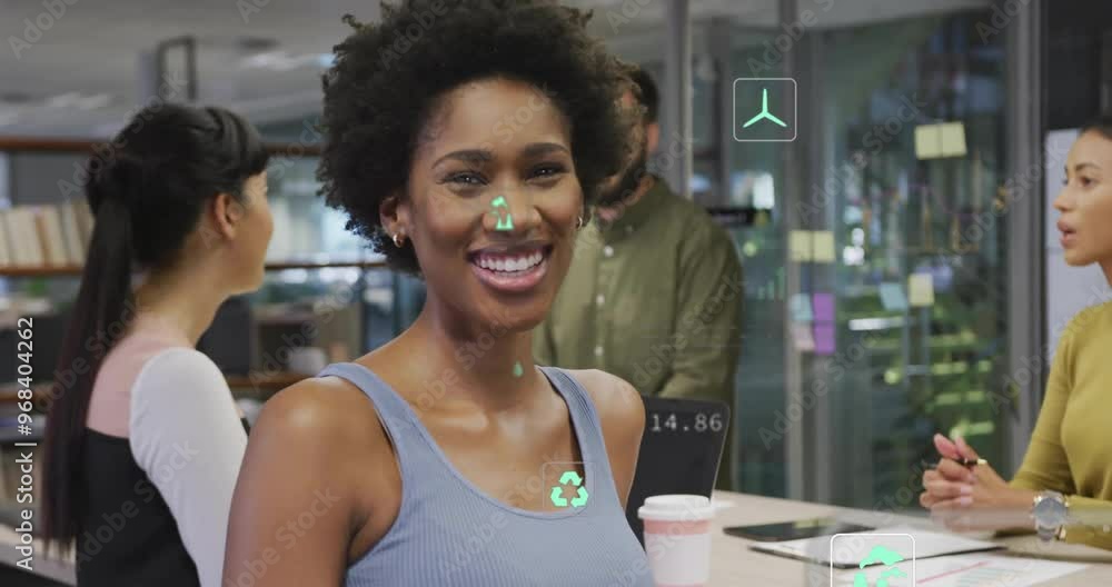 Animation of ecology icons and data processing over diverse colleagues talking in office Animation of ecology icons and data processing over diverse colleagues talking in office