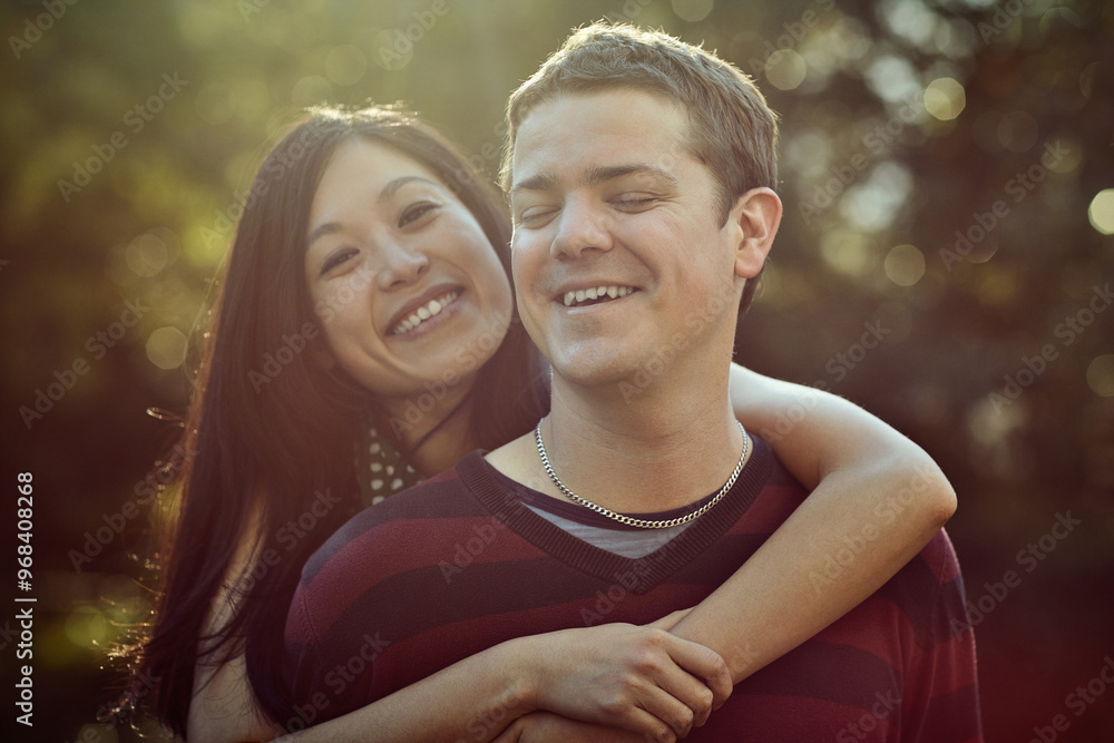 Naklejka premium Love, smile and couple on date in park with embrace, support and trust in interracial relationship together. Nature, man and woman relax in garden for outdoor bonding, happy romance and partnership.