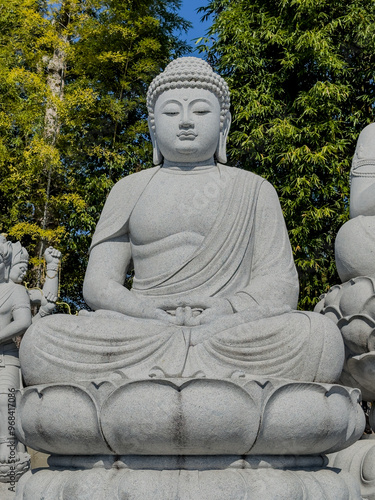 statue of buddha in seated position