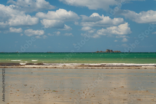 View of the coast of the city with beaches at low tide on a sunny summer day, Saint-Malo, Brittany, France
