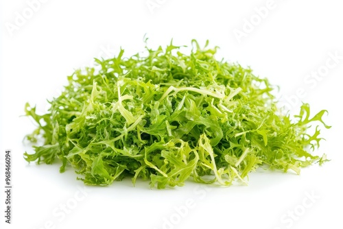 A vibrant pile of fresh frisee lettuce, ready to add a touch of bitterness and texture to your salads, soups, or as a side dish. Its delicate leaves and slightly bitter flavor complement various culin