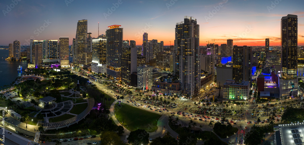 Naklejka premium Aerial view of downtown office district of of Miami Brickell in Florida, USA at night. High commercial and residential skyscraper buildings in modern american megapolis