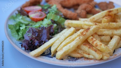 Wallpaper Mural Enjoy Delicious Comfort Food Crispy Fries, Juicy Chicken, and Fresh, Colorful Salad Torontodigital.ca