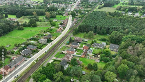 Aerial Tilt Up Railway Reveal Distant Aarschot City Drone Dolly In photo