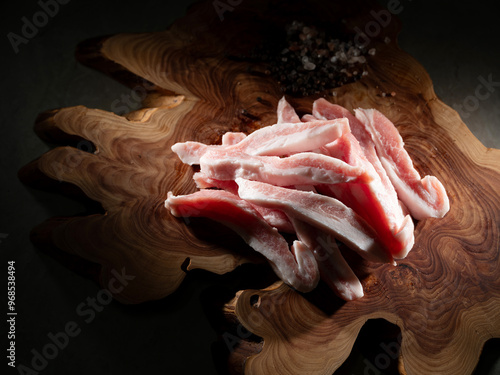 Pork Neck on old wooden board photo