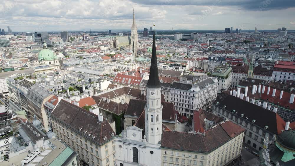 Drone aerial of Michaelerplatz and Church of Saint Michael in Vienna, establishing Drone aerial of Michaelerplatz and Church of Saint Michael in Vienna, establishing
