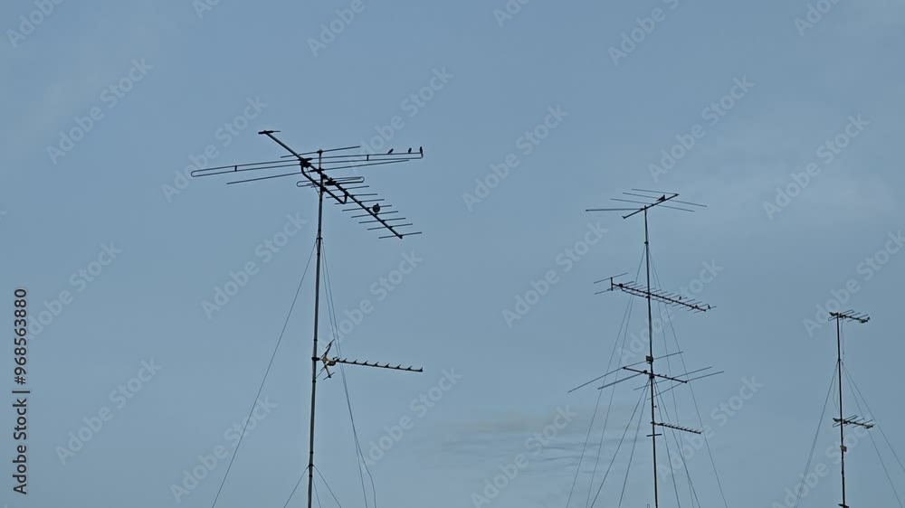 Old Television Antenna Against A Backdrop Of Sky And Clouds. Old Television Antenna Against A Backdrop Of Sky And Clouds.