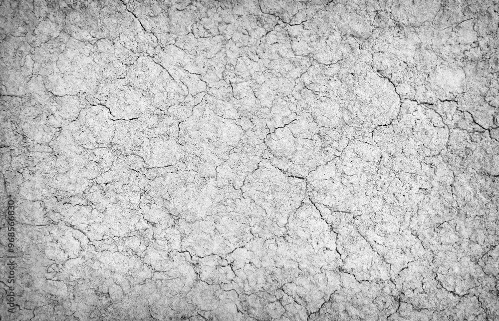 Texture of the dried earth with clay and sand, close-up or gray dry soil or cracked ground texture background. Texture of the dried earth with clay and sand, close-up or gray dry soil or cracked ground texture background.