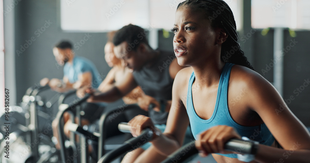 People, fitness and stationary bike at gym for exercise, training and workout with sweat. Cycling machine, energy and building muscles with cardio for health, self care and wellbeing with motivation People, fitness and stationary bike at gym for exercise, training and workout with sweat. Cycling machine, energy and building muscles with cardio for health, self care and wellbeing with motivation