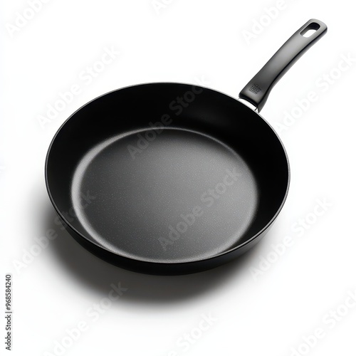 A black frying pan with a handle, designed for cooking various dishes.