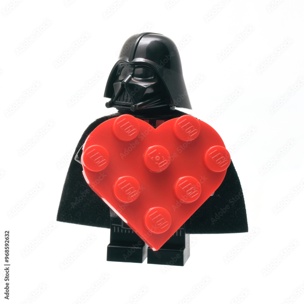 Naklejka premium Lego minifigure of Darth Vader with big red heart as symbol of love. Editorial illustrative image of popular children plastic bricks Star Wars.