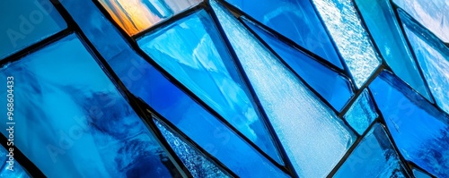 Abstract blue stained glass pattern with geometric shapes, artistic concept
