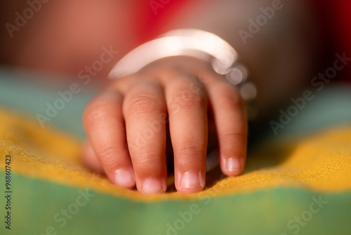 Indian Baby hands and feet, small baby hands, small baby feet, cute baby fingers, Close-up little hand of child, Love and relationship with infant, Care and support, Dreaming and protection. Asia