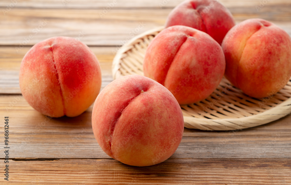 Peaches on colander on wooden background. Peaches on colander on wooden background.