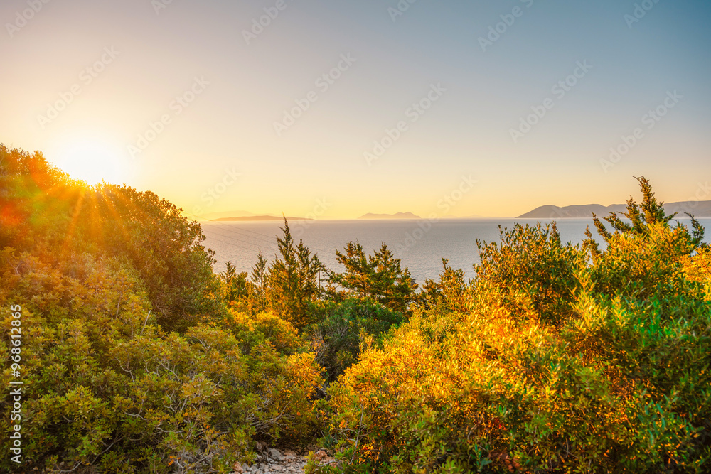 Fototapeta premium Lighthouse on the cliff. Seascape of Cape Lefkatas with old lighthouse on Lefkada island, Greece. Beautiful views of azure sea water and nature with cliffs