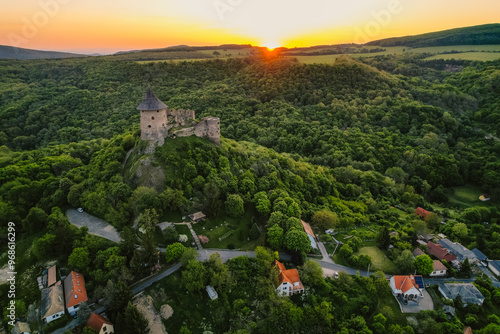 Ruins of a medieval castle Somoska or Somoskoi var. on borders of southern Slovakia and Hungary at sunrise time. photo