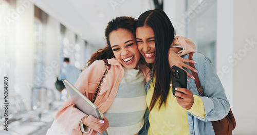 Friends, happy and excited in university for hug, storytelling and good news on phone. Students, support and mobile in hallway for admission, unexpected notification or acceptance to higher education