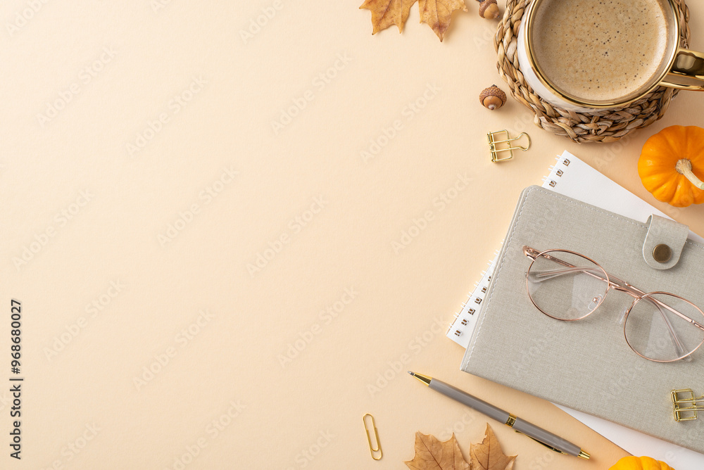 Samolepka Cozy autumn office desk scene with a warm coffee mug, eyeglasses, and a notebook