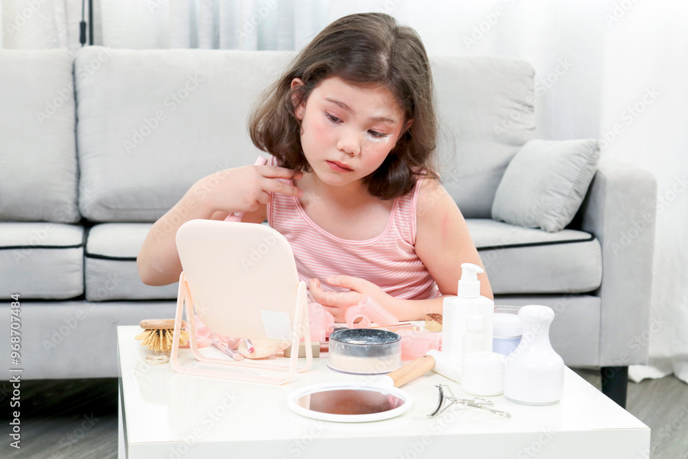 Little girl enjoys to play with makeup in the living room. Cute girl happy with various makeup tools.Happy holidays concept... Little girl enjoys to play with makeup in the living room. Cute girl happy with various makeup tools.Happy holidays concept...
