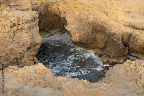 sea ​​water accumulated between rocks. Sea wave between rocks. Carved rocks by the sea. sea water trapped between rocks.
 Cyprus.