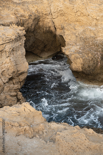 sea ​​water accumulated between rocks. Sea wave between rocks. Carved rocks by the sea. sea water trapped between rocks.
 Cyprus.