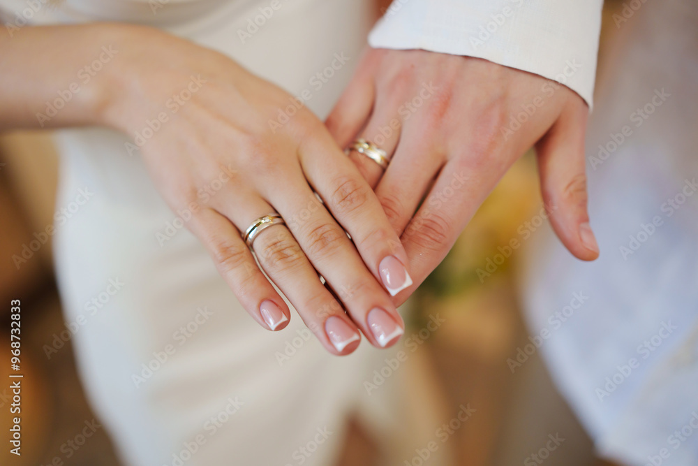 Male and female hand with wedding rings. French manicure for the bride. Male and female hand with wedding rings. French manicure for the bride.