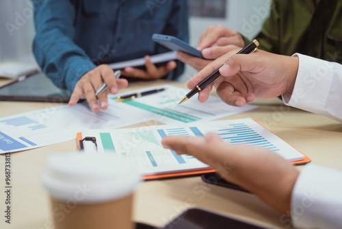 Wallpaper Mural Close-up of a businessman in a meeting at the office discussing topics related to digital marketing management, financial analysis, business writing, teaching, and venture capital investments. Torontodigital.ca