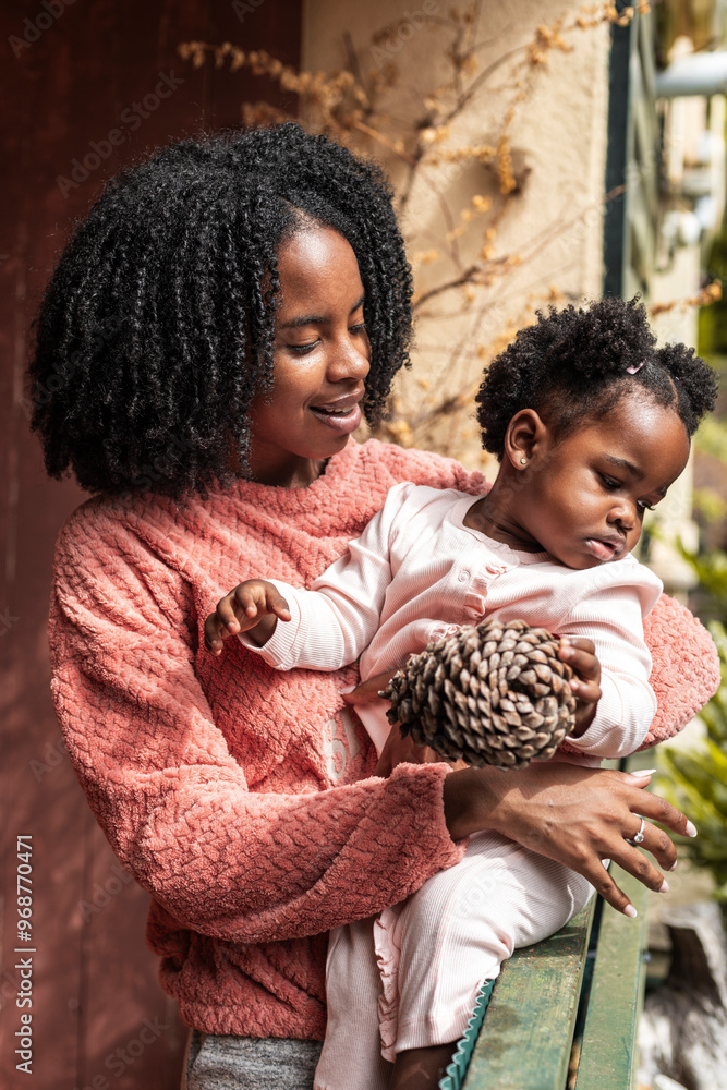 Mother and daughter enjoy a quiet moment outdoors Mother and daughter enjoy a quiet moment outdoors