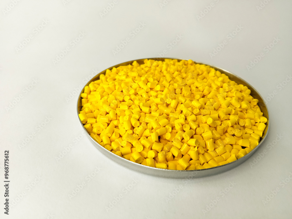 Yellow masterbatch granule, yellow polymer granules in a cup, cold cutting type granule texture, isolated on white background, for industrial plastic company profile product catalog design Yellow masterbatch granule, yellow polymer granules in a cup, cold cutting type granule texture, isolated on white background, for industrial plastic company profile product catalog design