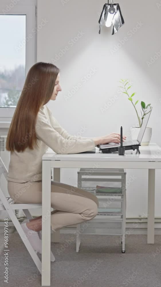 Positive young focused female freelance employee working, typing on laptop prompt, uses ai tools, thinking of creative idea, business strategy for project, distance learning. Vertical Video Positive young focused female freelance employee working, typing on laptop prompt, uses ai tools, thinking of creative idea, business strategy for project, distance learning. Vertical Video