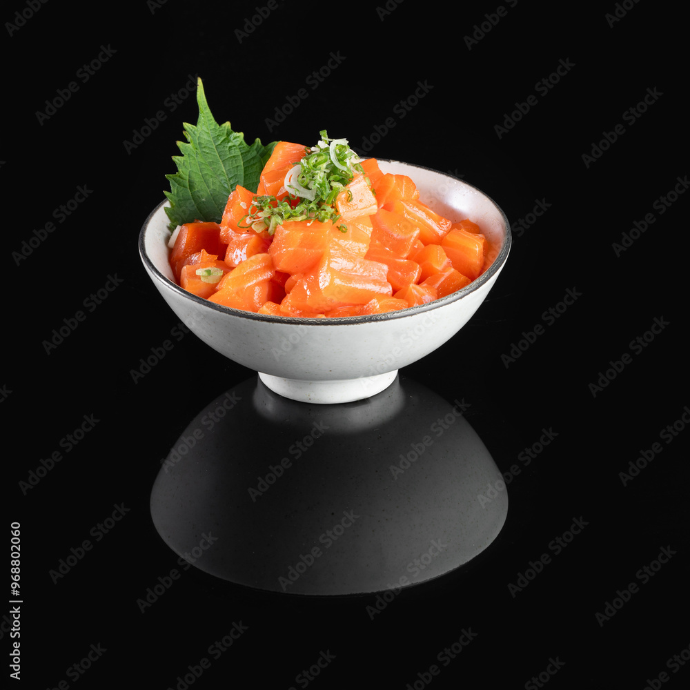 Fresh salmon tartare garnished with herbs served in an elegant bowl, perfect for a gourmet seafood presentation. Fresh salmon tartare garnished with herbs served in an elegant bowl, perfect for a gourmet seafood presentation.