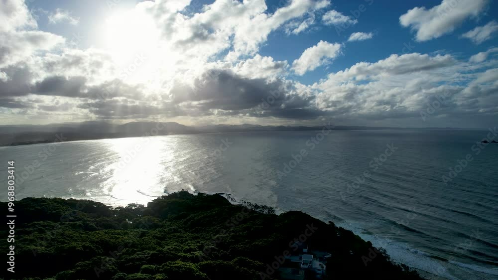 The sunlit ocean and lush coastline at byron bay, australia, aerial view The sunlit ocean and lush coastline at byron bay, australia, aerial view