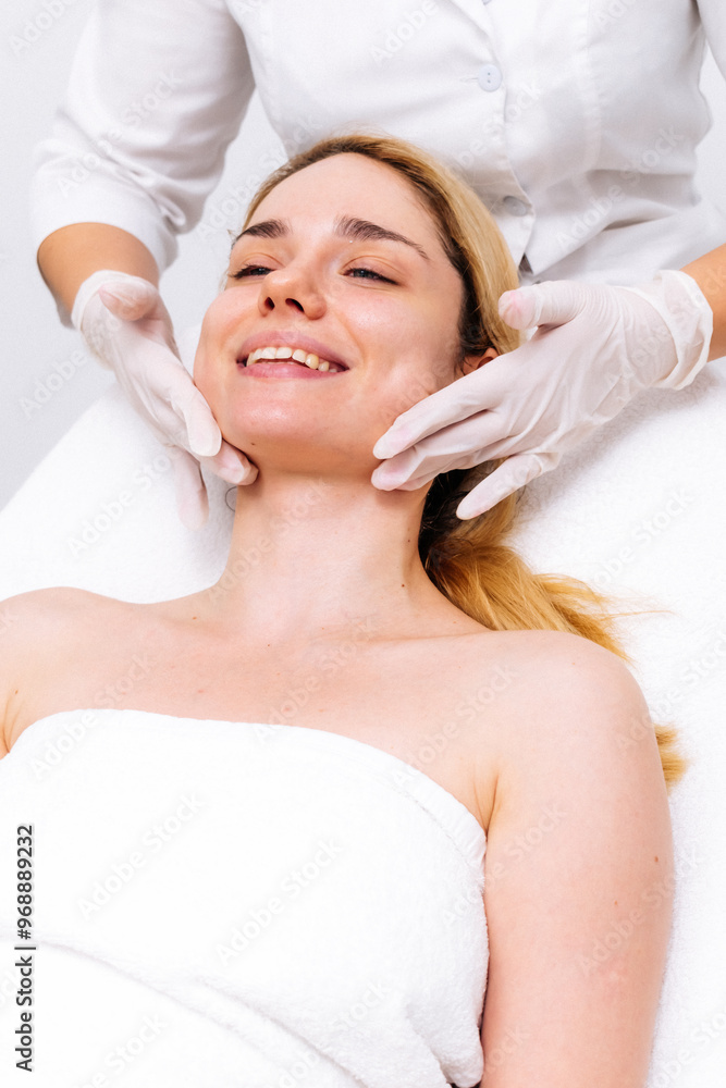 Luxurious spa setting: facial massage in a modern cosmetic clinic. Premium care for relaxation and rejuvenation. Ideal for promoting spa treatments and cosmetic services. Luxurious spa setting: facial massage in a modern cosmetic clinic. Premium care for relaxation and rejuvenation. Ideal for promoting spa treatments and cosmetic services.