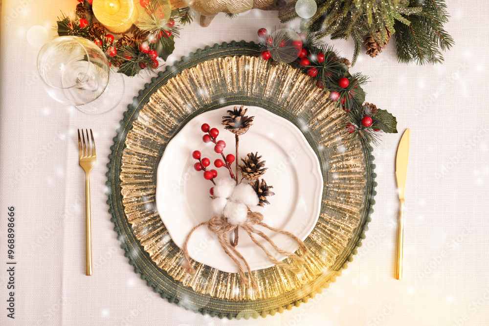 Luxury festive place setting with beautiful decor for Christmas dinner on white table, flat lay. Bokeh effect Luxury festive place setting with beautiful decor for Christmas dinner on white table, flat lay. Bokeh effect
