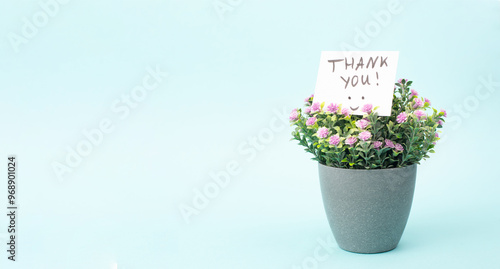 Fototapeta Naklejka Na Ścianę i Meble -  Thank you card with flowers and a happy smiling face, being thankful, support, help and charity concept, positive attitude 