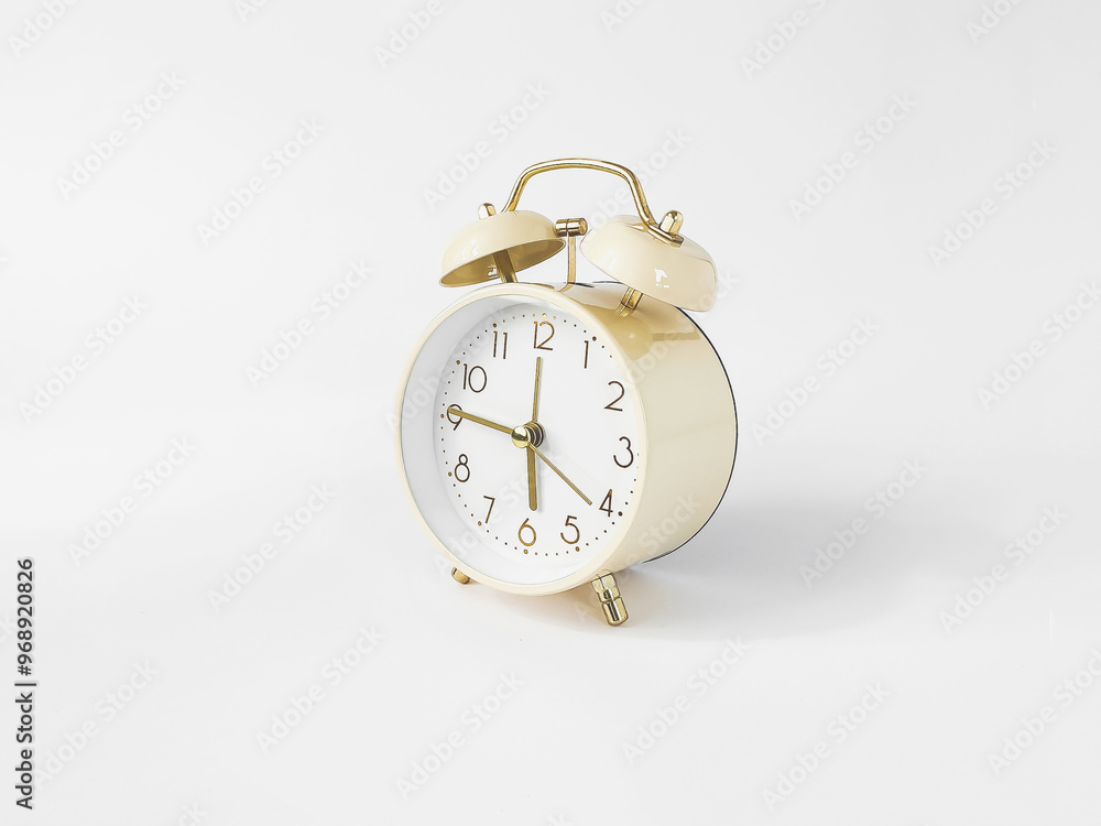horizontal photo of round classic beige alarm clock with on white background, copyspace horizontal photo of round classic beige alarm clock with on white background, copyspace